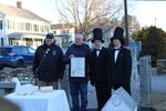 Senator Jeff Gordon and State Representative Pat Boyd presenting Scramble with a state citation