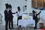Scramble the Duck and his handlers celebrate the prediction